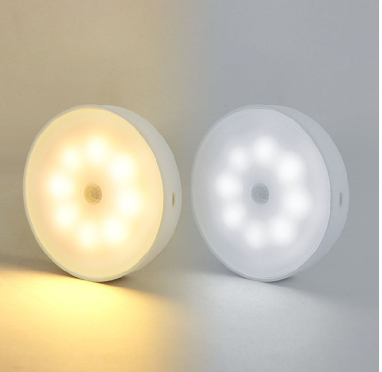 Warm white and cool white rechargeable motion-sensor puck lights side by side