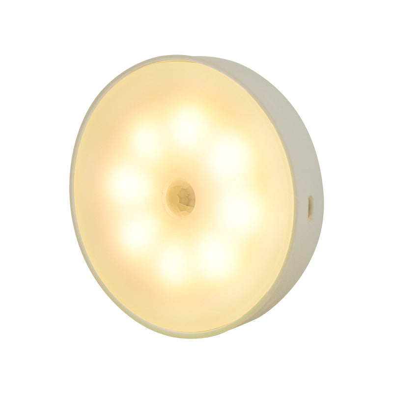 Round warm white motion-sensor night light with 8 LEDs and center motion sensor