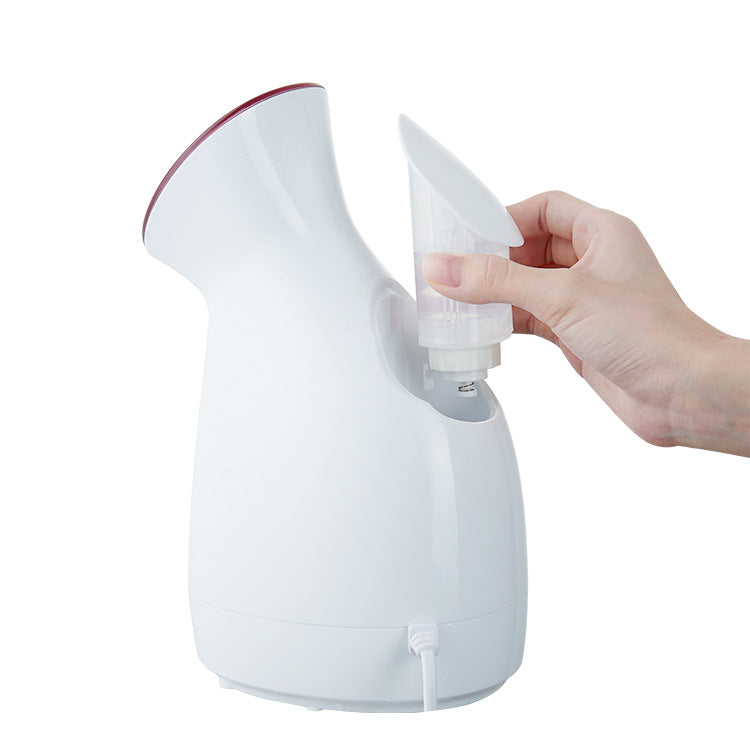 Portable facial sauna steamer showing compact design and water tank