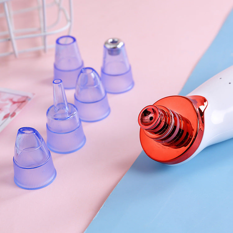 Pore cleaner vacuum showing different suction probe attachments for various skin types